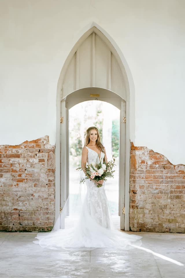 bride in front of antique door