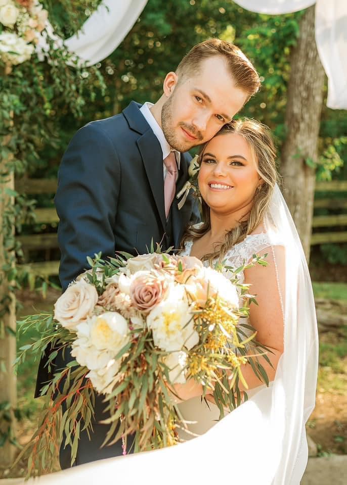 groom embracing bride