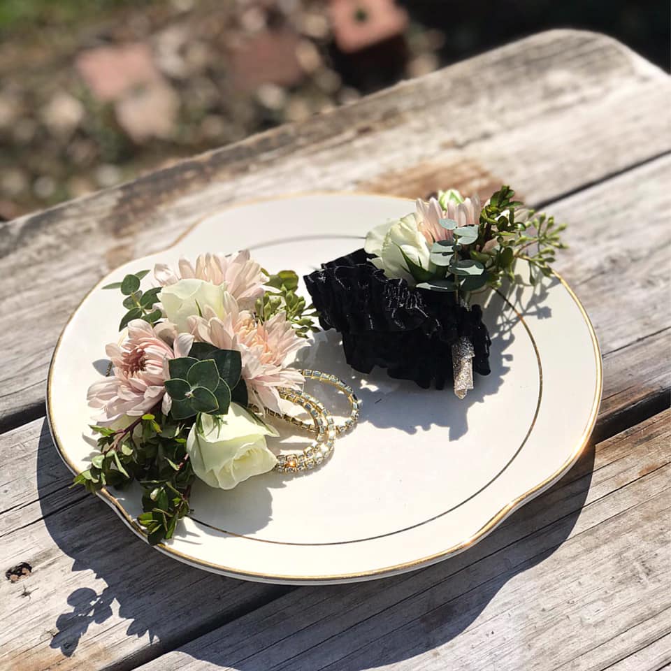 white and pink prom boutonniere and corsages