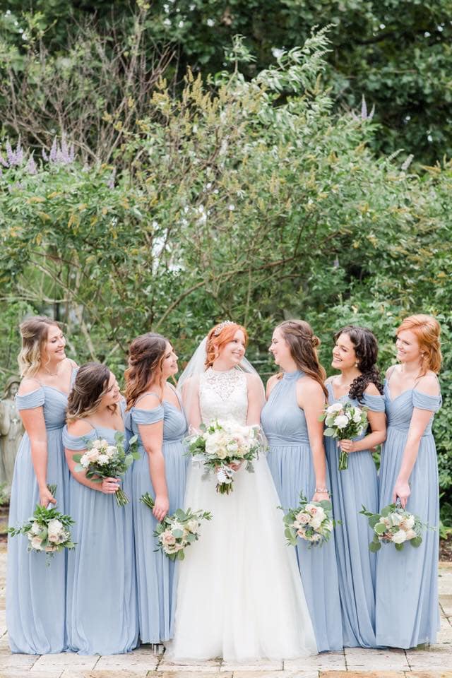 bride and bridesmaids in light blue gowns